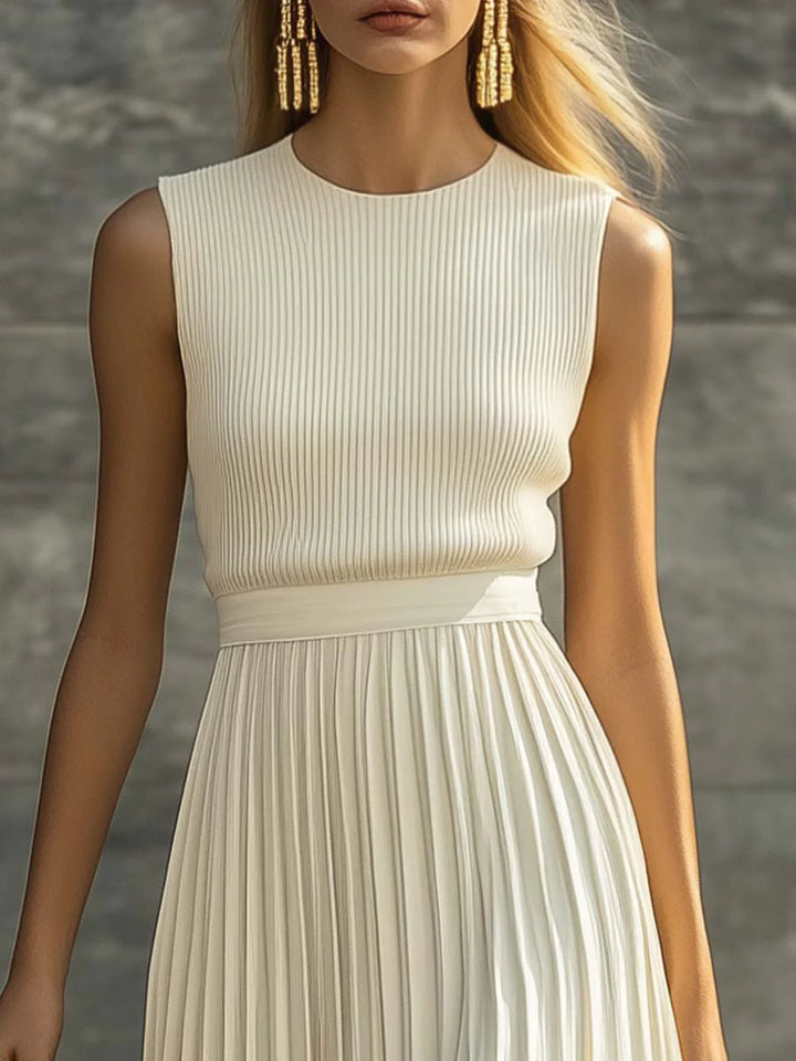 Detail of ribbed knit upper and pleated chiffon skirt on women's sleeveless maxi dress