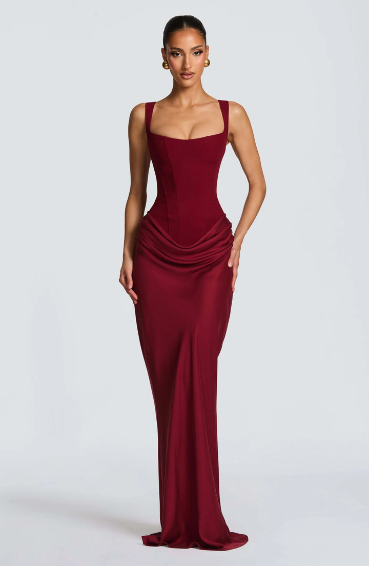 Detail of the structured fabric and smooth finish on the bodycon maxi dress