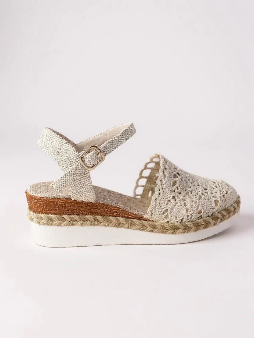 Detail shot of boho platform sandals showing crochet pattern and adjustable ankle strap buckle