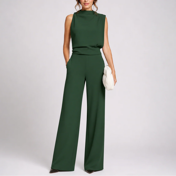 Sleeveless wide-leg jumpsuit in forest green with high neckline and flowing trousers