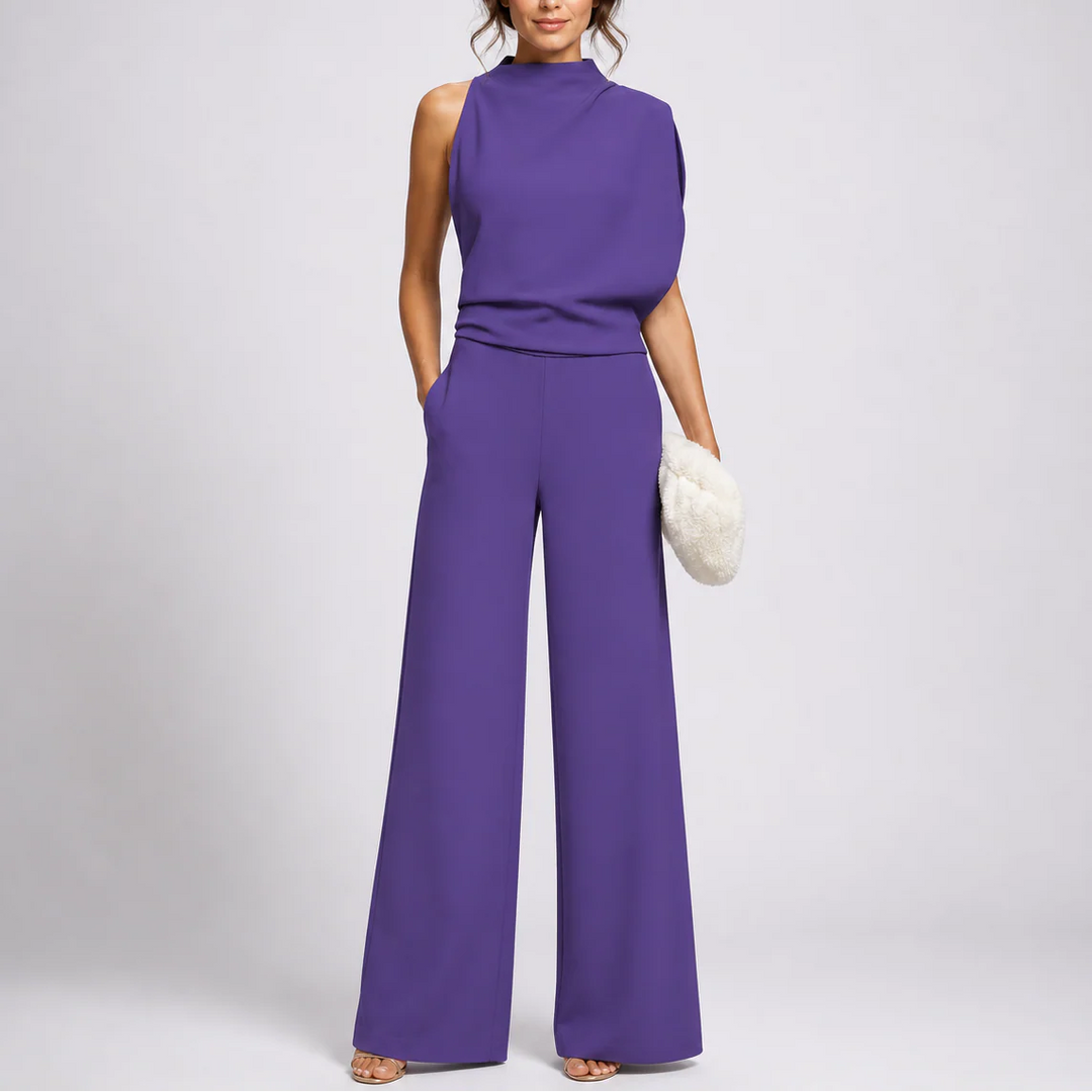 Side angle of high-neck jumpsuit with relaxed fit through the legs
