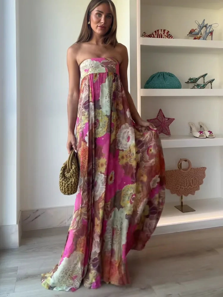 Close-up view of strapless bodice and abstract floral print detail on maxi dress