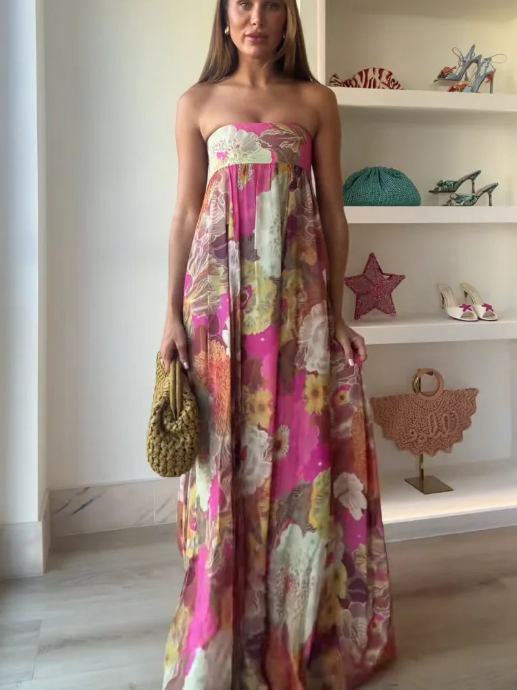 Back view of strapless maxi dress with vibrant floral print and relaxed drape