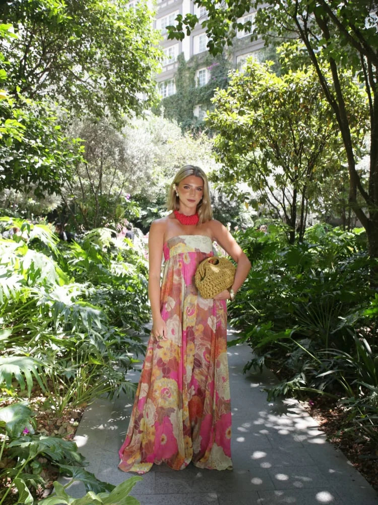 Detail of empire waist and print pattern on strapless floral maxi dress