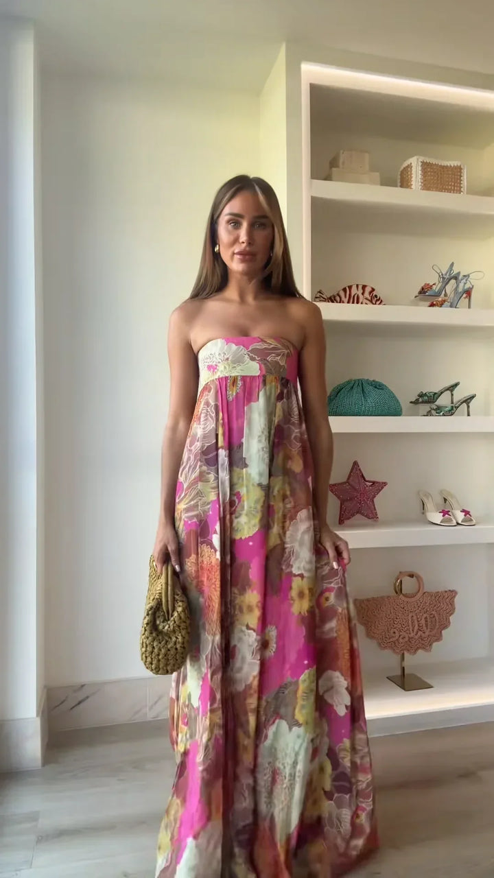 Strapless floral maxi dress shown in natural light displaying vibrant colour palette