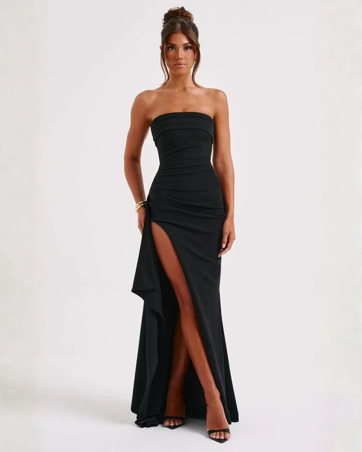 Strapless ruched maxi dress in black with thigh-high split and cascading ruffle detail for formal occasions