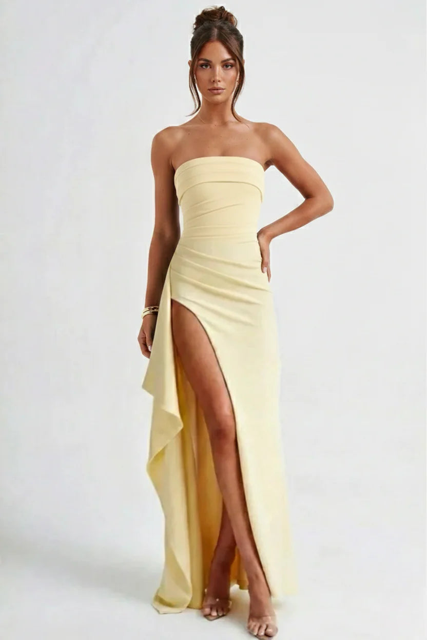 Strapless ruched maxi dress in yellow colourway showing figure-hugging fit and split