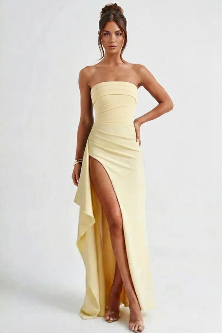 Strapless ruched maxi dress in yellow colourway showing figure-hugging fit and split