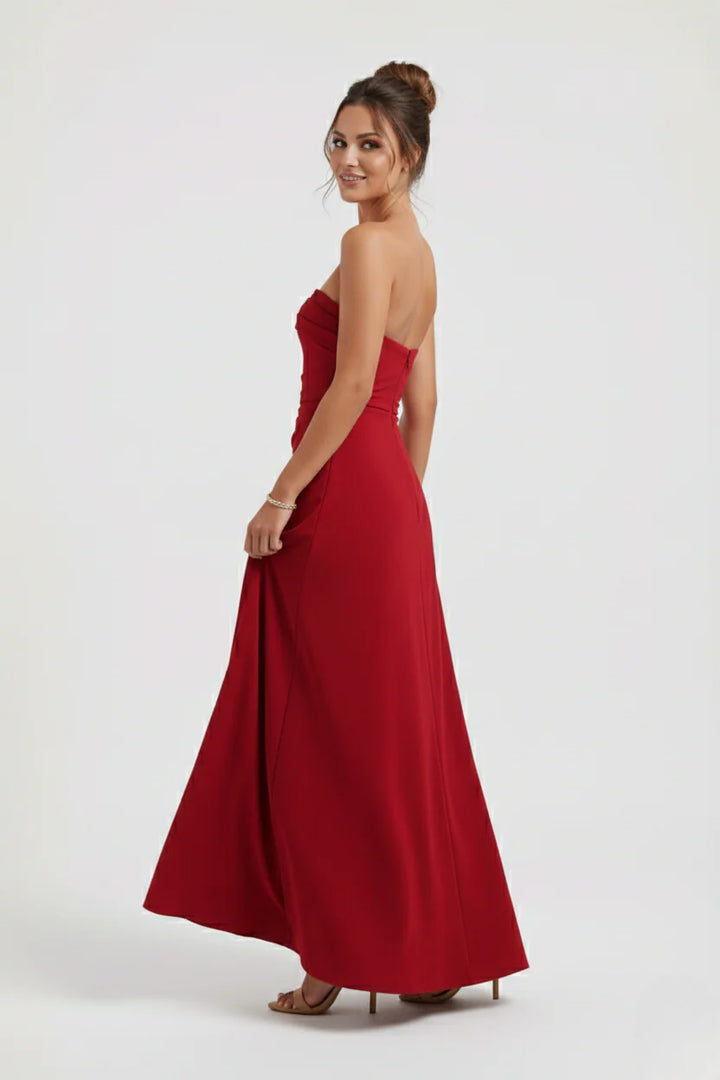 Close-up of strapless neckline and horizontal ruching detail on evening maxi dress