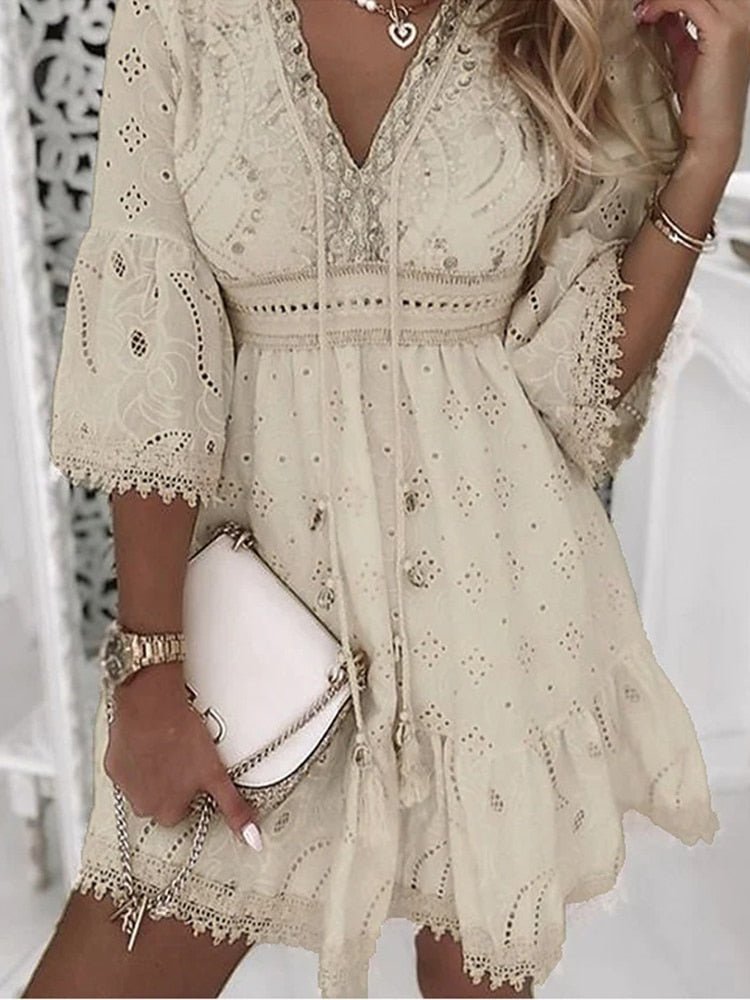 Boho mini dress V-neck lace bell sleeves A-line silhouette in cream eyelet fabric with scalloped trim