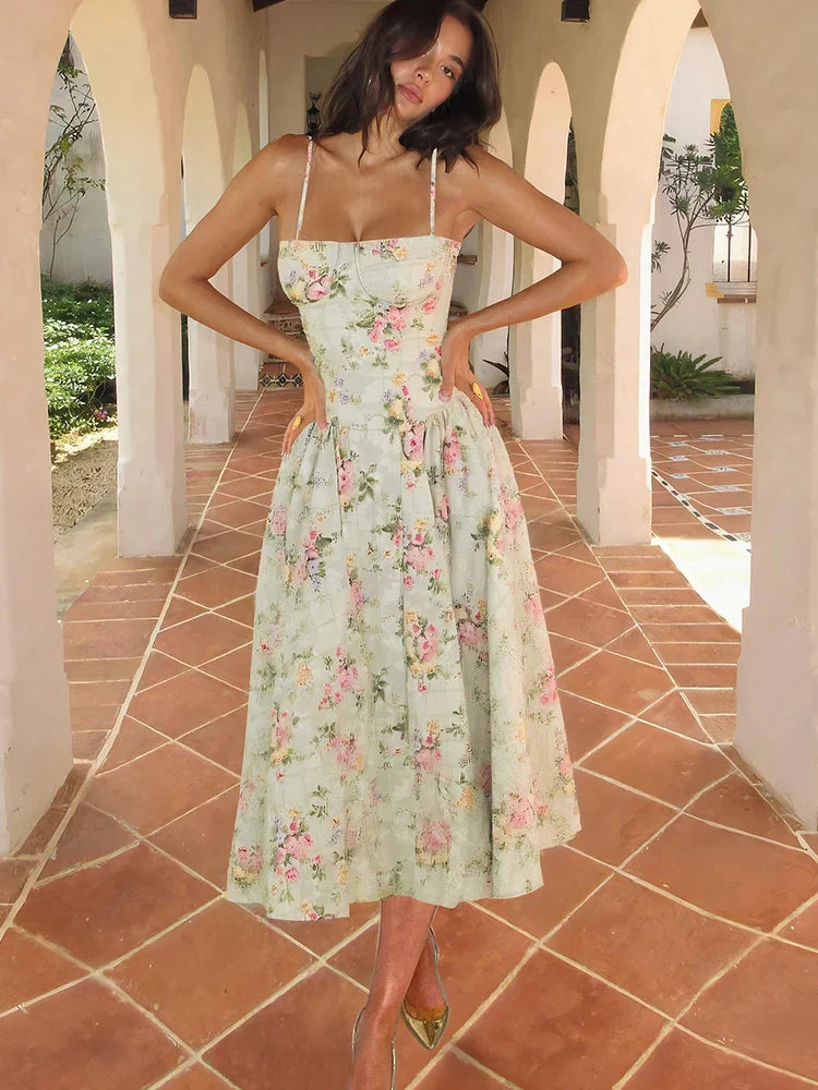 Women's Floral Strap Midi Wedding Guest Dress in soft pastel floral print with structured bodice and flowing midi skirt