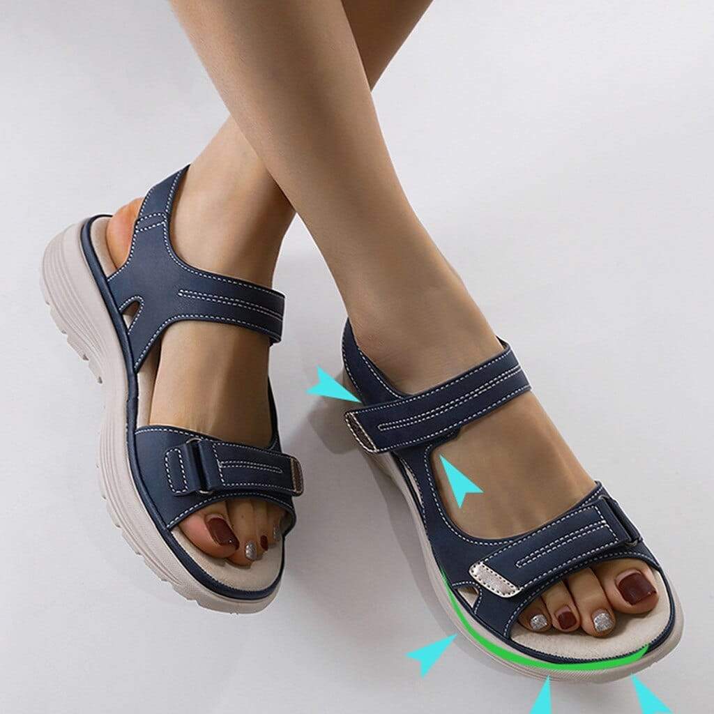 Close-up view of orthopaedic walking sandals with arch support showing hook-and-loop closures and shock-absorbing sole design