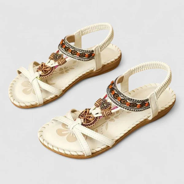 Full view of women's T-strap sandals featuring beaded detailing and contoured footbed for all-day comfort