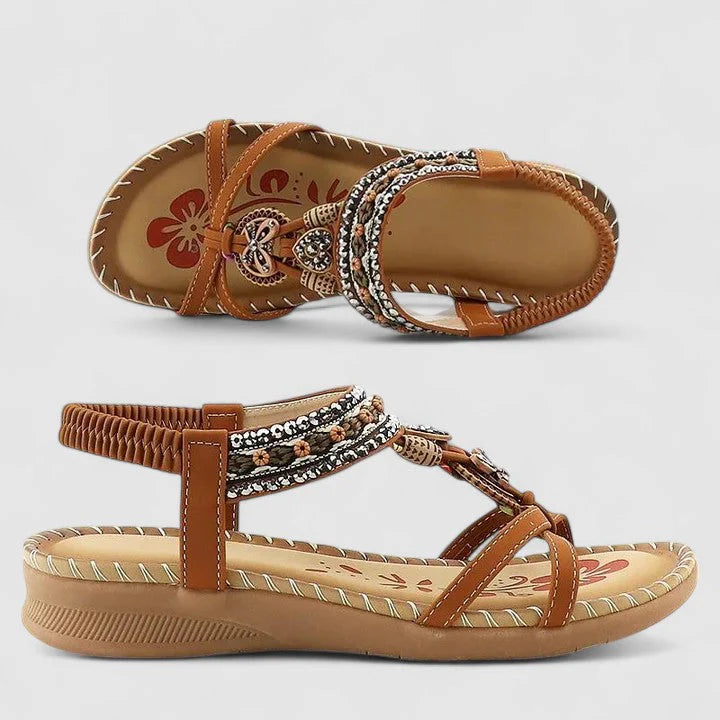Women's flat sandals with elastic ankle strap and decorative beaded embellishments for summer wear