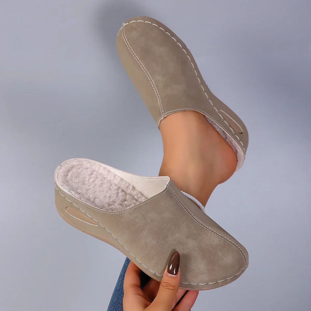 Blue suede-effect slippers with fleece lining and slip-on silhouette for relaxed indoor footwear
