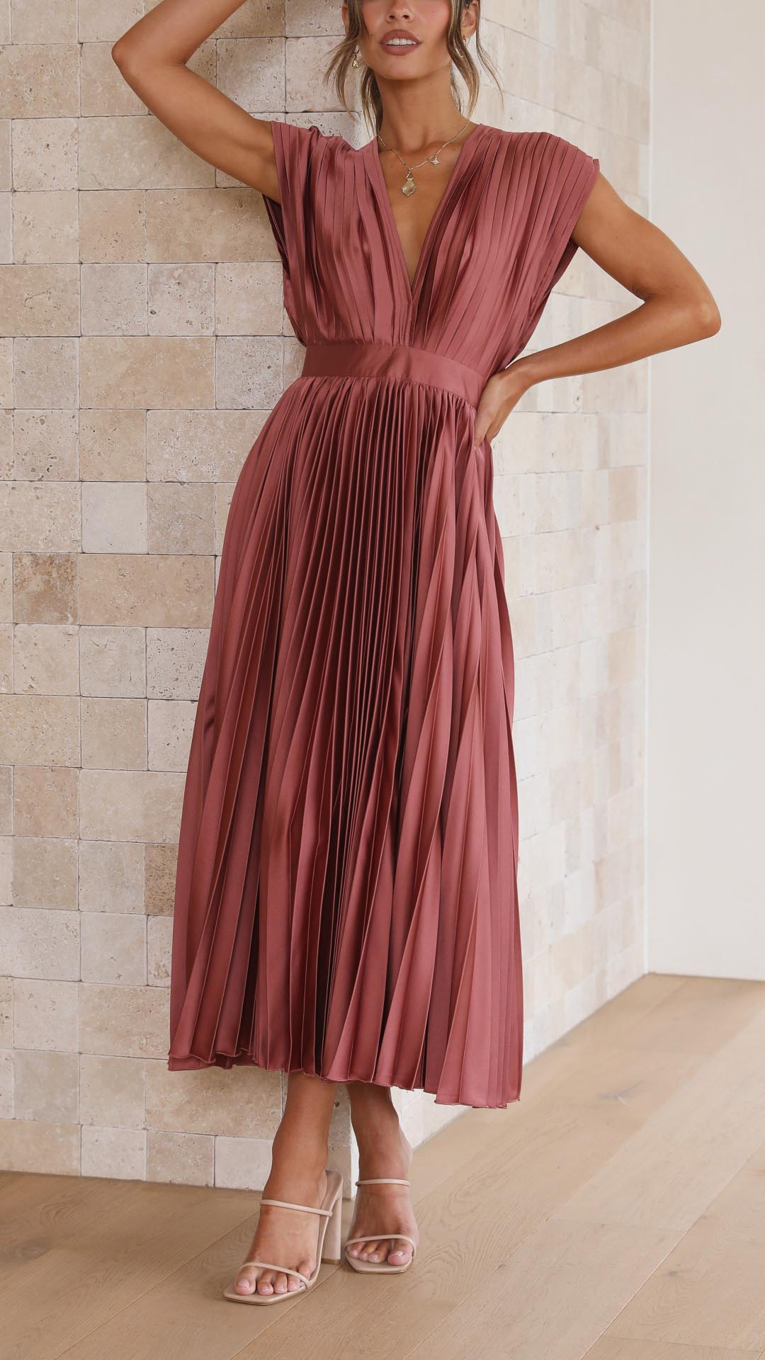 Full-length view of pleated V-neck midi dress in dusty rose for formal occasions