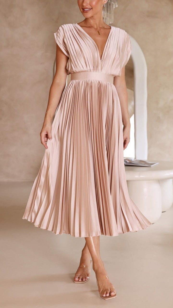 Detail shot of vertical pleating on midi dress skirt with smooth fabric finish