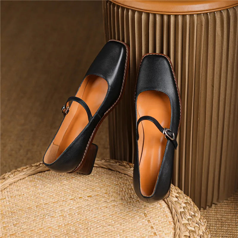 Women's strap block heel shoes in tan brown displayed on neutral background showing full silhouette