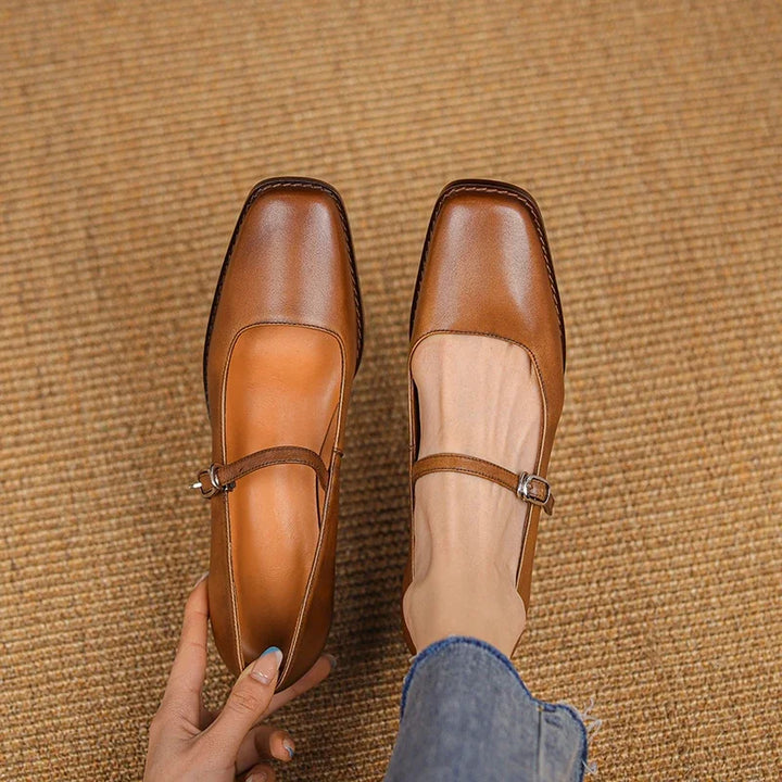 Side profile of women's strap block heel shoes displaying block heel structure and slim buckle strap