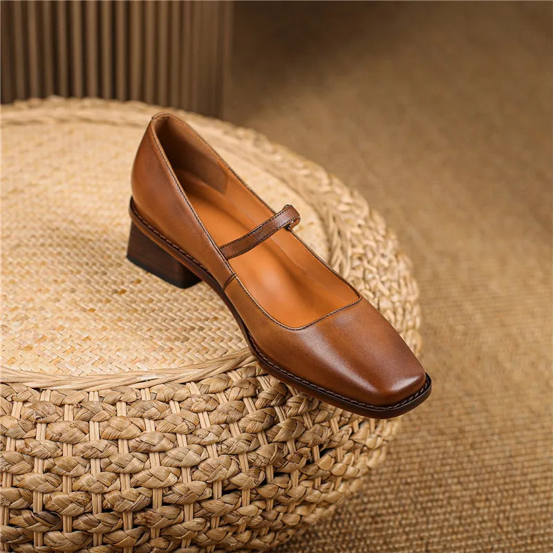 Detail shot of adjustable buckle strap closure on women's block heel shoes