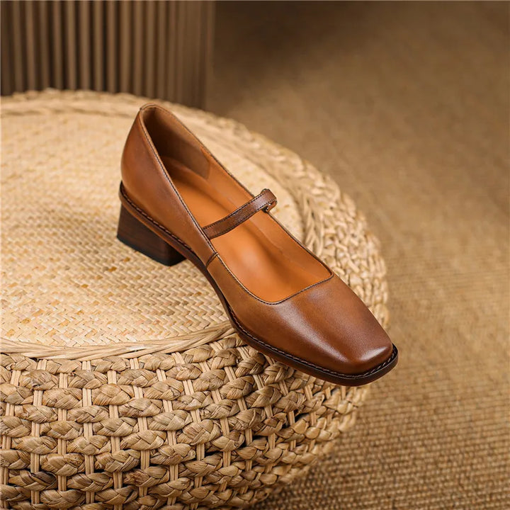 Detail shot of adjustable buckle strap closure on women's block heel shoes