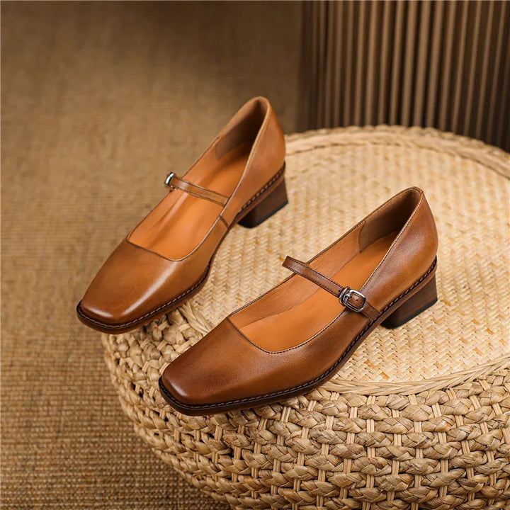 Women's strap block heel shoes in black colourway showing versatile design for work wear