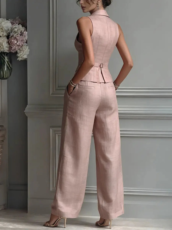 Back view of sleeveless waistcoat and wide-leg trousers showing tailored construction and fit