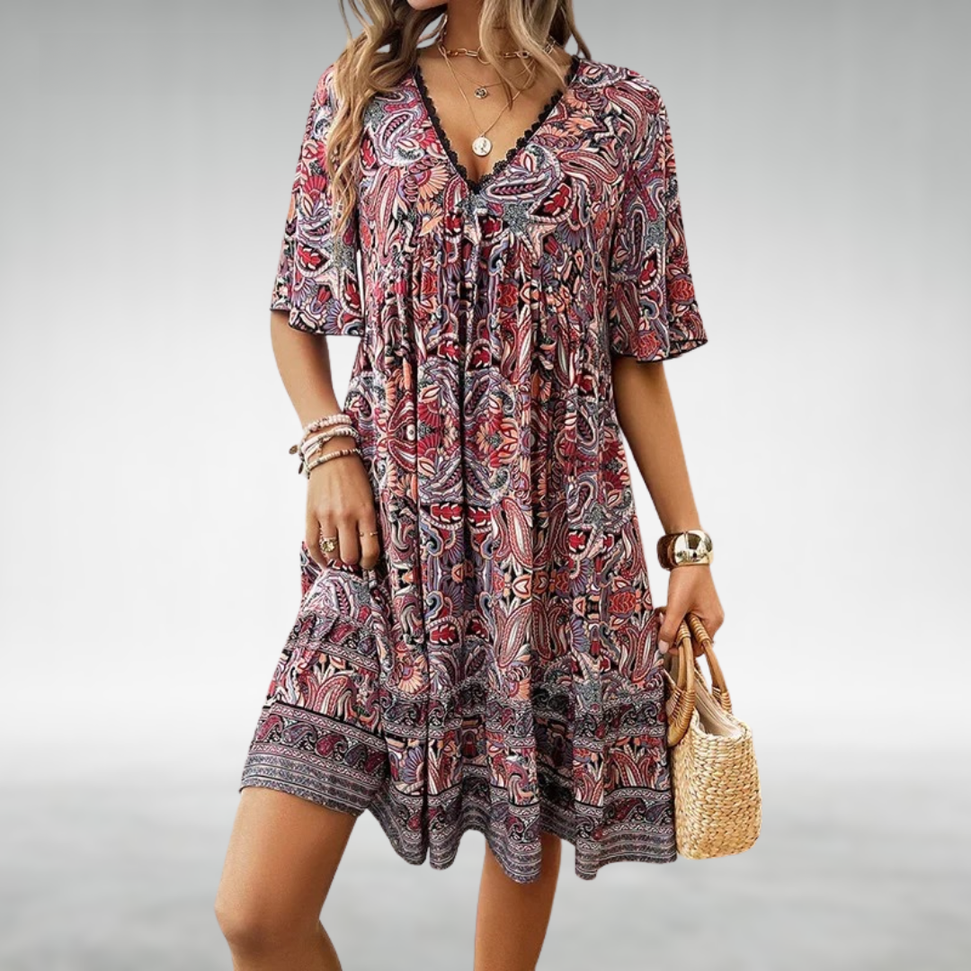 Detail shot of Women Summer Boho Paisley Mini Dress featuring decorative border print at hemline