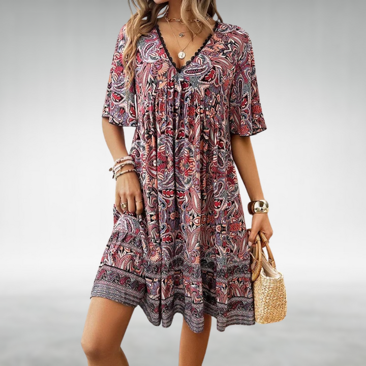 Detail shot of Women Summer Boho Paisley Mini Dress featuring decorative border print at hemline
