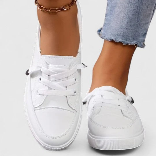 Sophie wearing white Women Casual Orthopedic Platform Sneakers with clean lace-up design and elevated sole for everyday comfort