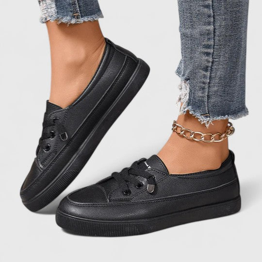 Side angle of elevated sole on platform trainers providing stable base for all-day movement