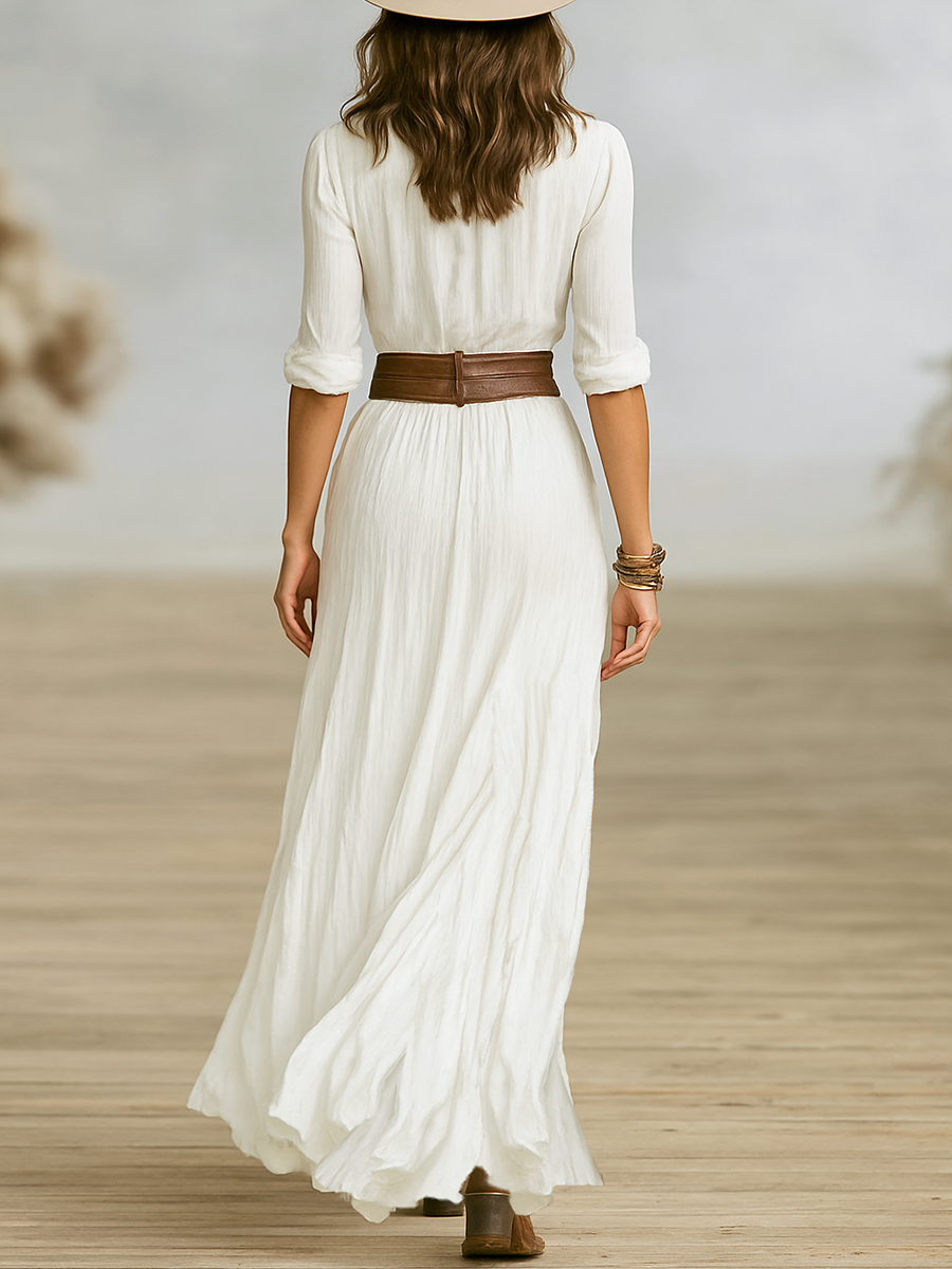 Close-up of elasticated cuff detailing and three-quarter sleeve design on maxi dress