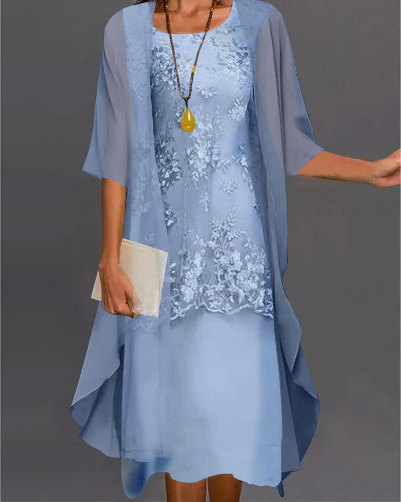 Close-up view of floral lace appliqué detail on champagne midi dress with coordinating jacket