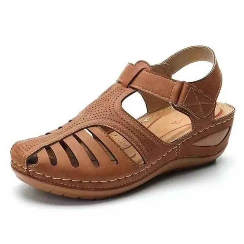 Side view of women's orthopaedic sandals showing wedge sole and cutout panel detailing for breathability