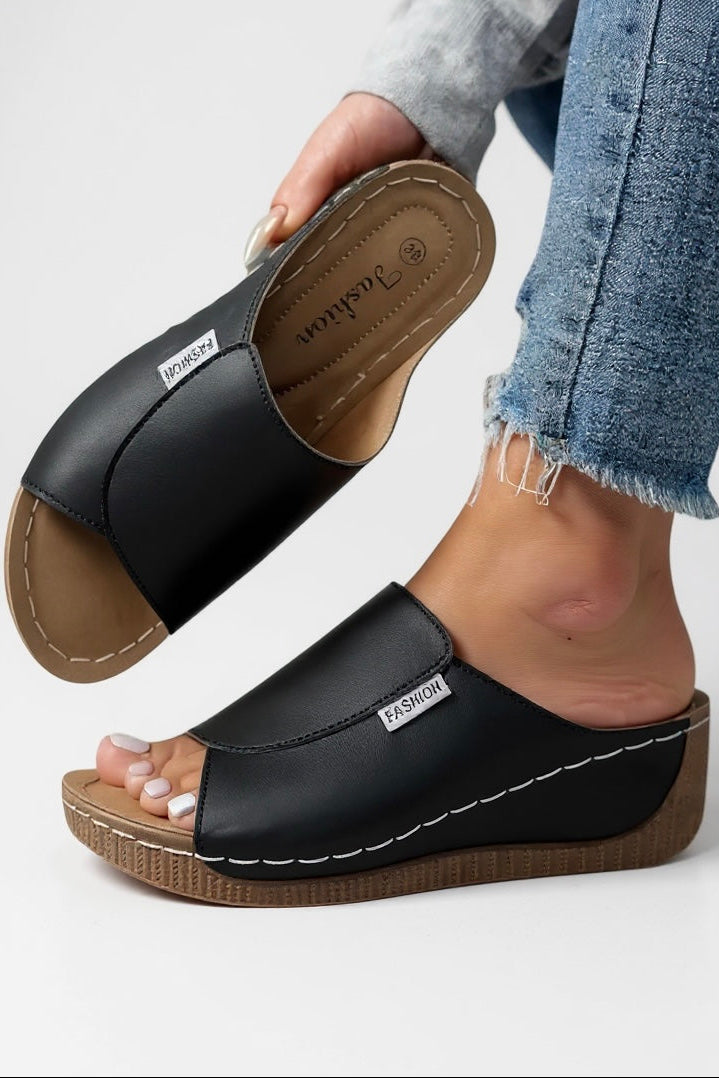 Detail of platform sole with textured base and contoured footbed