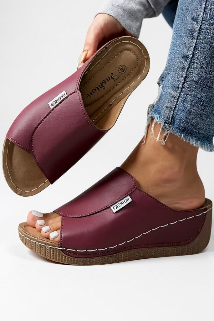 Slip-on platform sandals in cream showing easy-wear construction