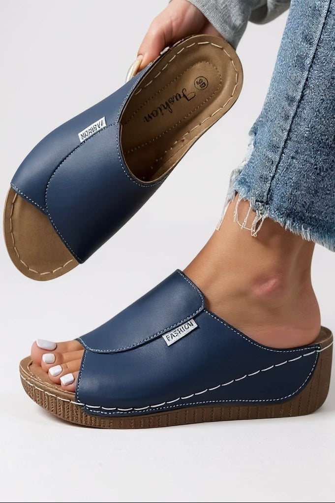 Minimalist platform slides styled with casual summer outfit