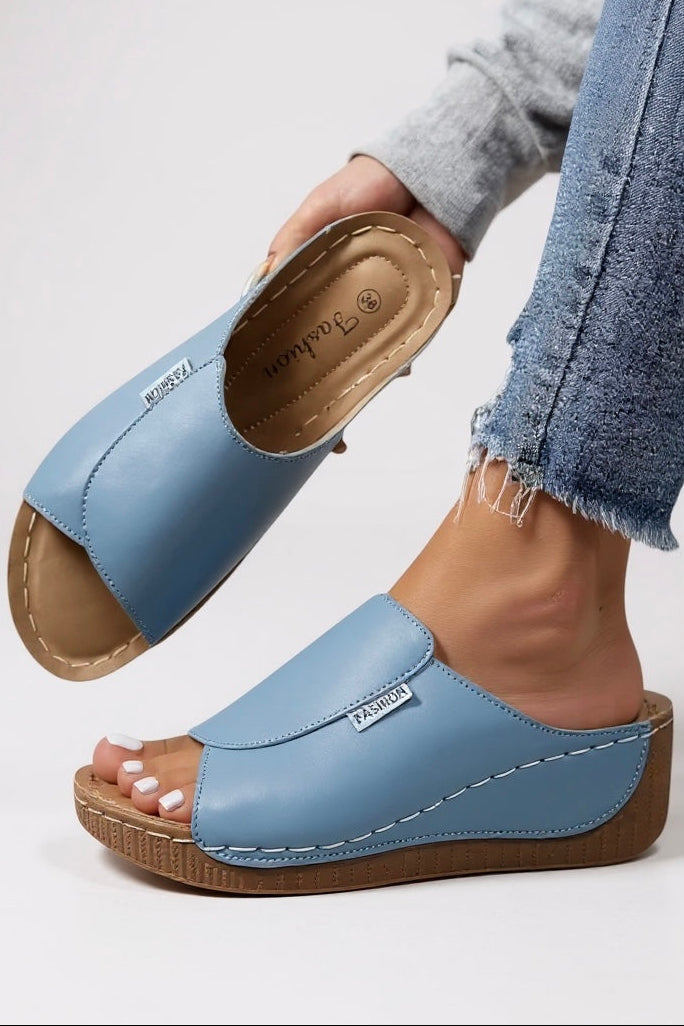 Contoured footbed platform slides in neutral cream tone