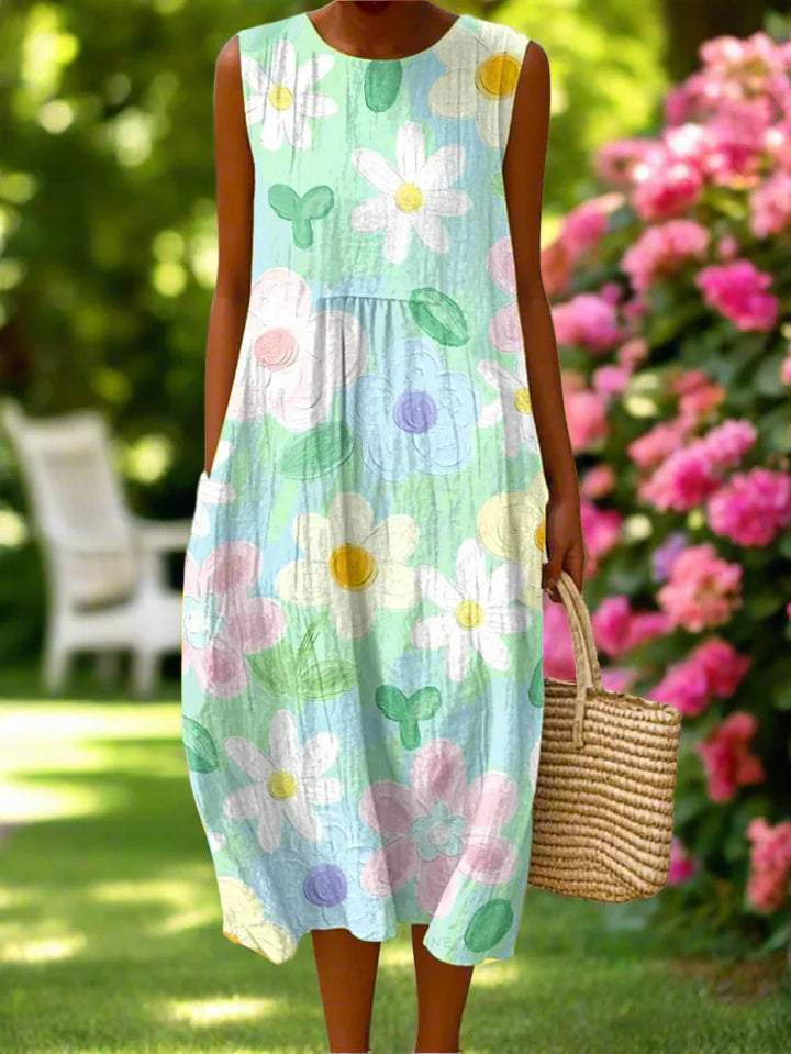 Sleeveless floral midi dress detail showing painterly patchwork print with gathered waist and round neckline
