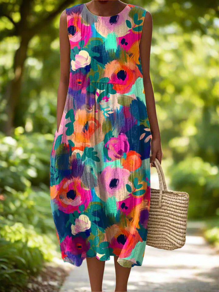 Vibrant floral print midi dress with sleeveless design and comfortable loose fit falling below the knee