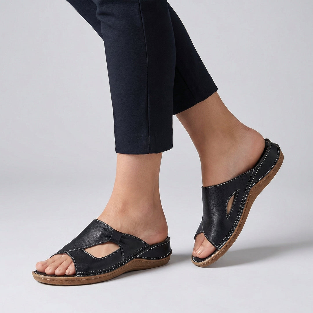 Tilly wearing Orthopedic Slide Sandals Open-Toe Leather Comfort with contrast stitching and cutout detail on low wedge sole
