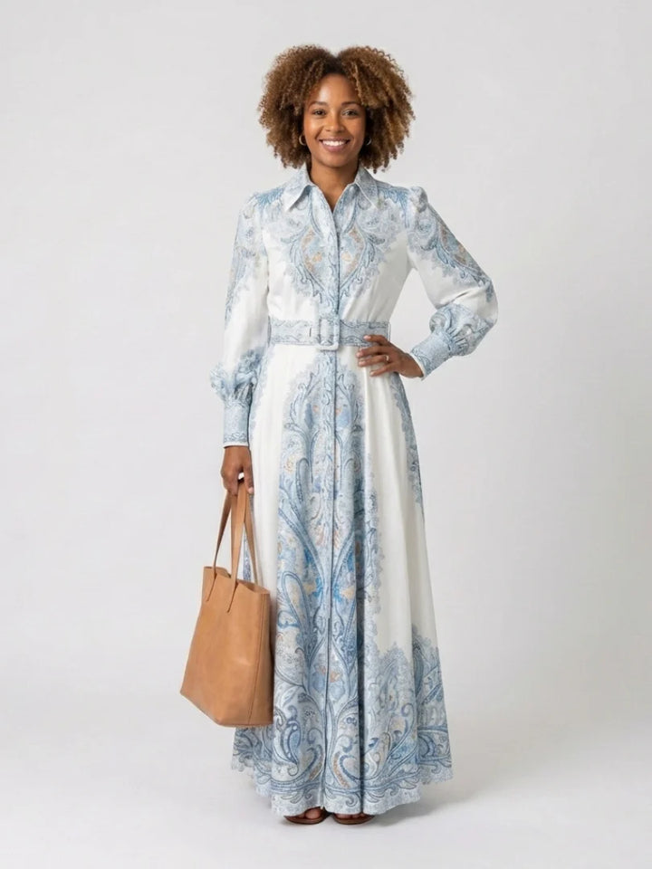 Full-length view of high neck printed long sleeve maxi dress showing elegant silhouette and paisley design