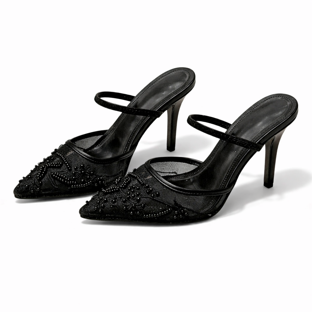 Detail of floral embroidery pattern on sheer mesh mule heels