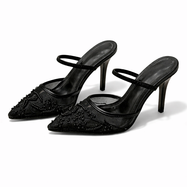 Detail of floral embroidery pattern on sheer mesh mule heels