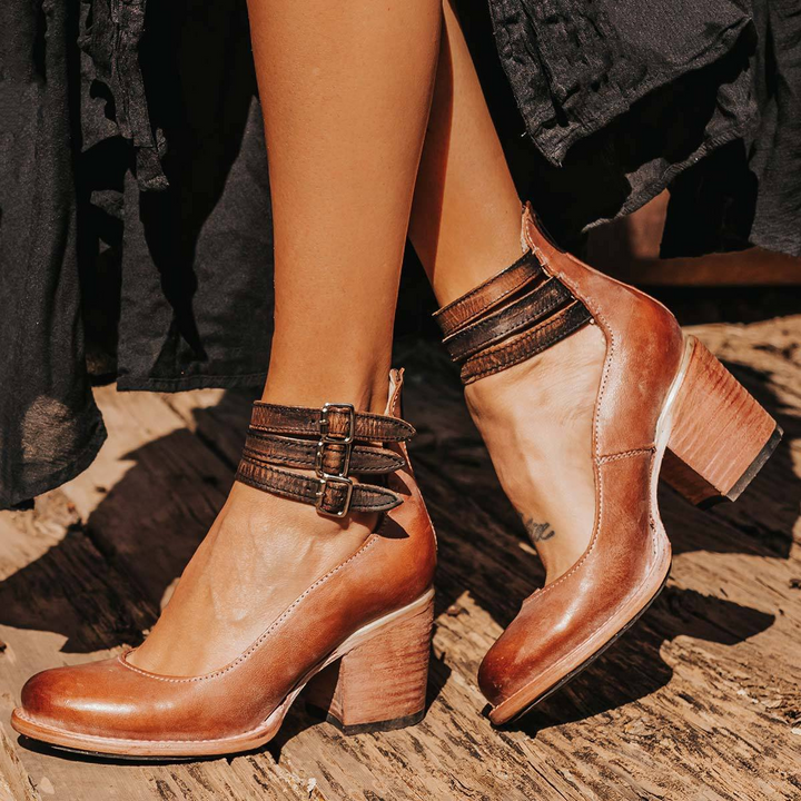 Side profile of block heel ankle boots showcasing vintage silhouette and stacked heel finish