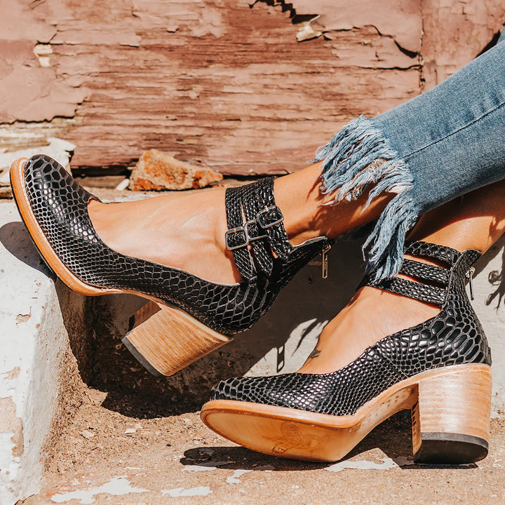White ankle strap heels with double buckle fastening and block heel for all-season versatility